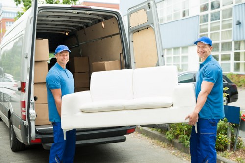 Same day removals service in Shoreditch with movers loading furniture