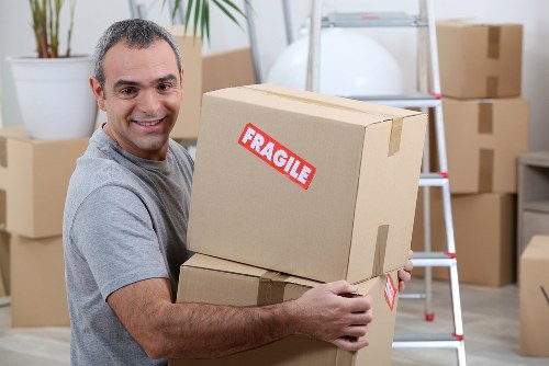 Specialist team managing piano moving through narrow Shoreditch access