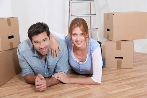 Team preparing furniture and workstations for office relocation