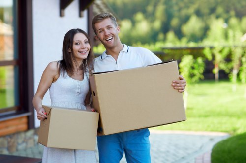 Professional movers handling furniture during a Shoreditch student move