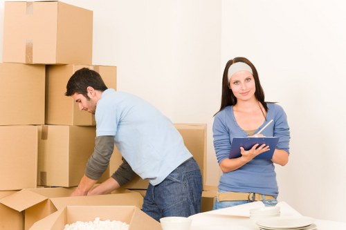 Crew using careful manual handling techniques during relocation