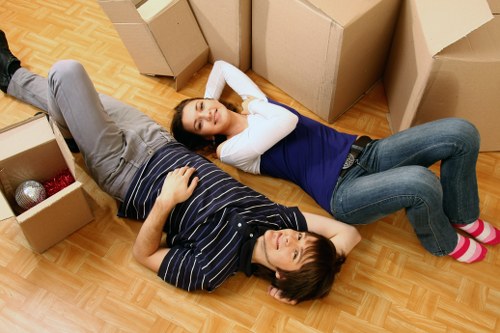 Local removals team handling furniture during a Shoreditch home move
